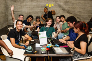 Gen Z students collaborating on a startup project during an entrepreneurship bootcamp.